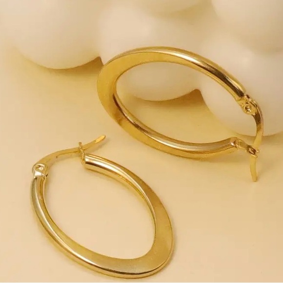 Stainless Steel Oval Hoop Earrings Plated in 18K Yellow Gold - Picture 2 of 3